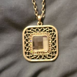 Gold colored long necklace